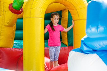 Fototapeta na wymiar child on a colorful trampoline