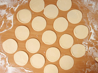 Dough cutted into circles. Preparation Meat Dumplings.
