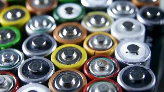 Used batteries from different manufacturers. collection and recycling, high danger for environment concept