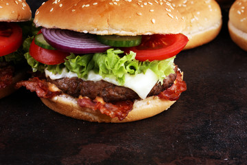 Tasty fresh meat burgers with salad and cheese. Homemade angus burger.