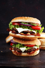 Tasty fresh meat burgers with salad and cheese. Homemade angus burger.