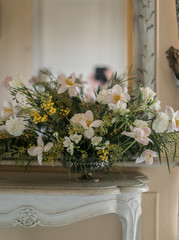  mirror, bouquet, white console