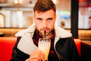Man drinks milkshake
