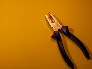 Tool for home repair. Tool on a colored background.