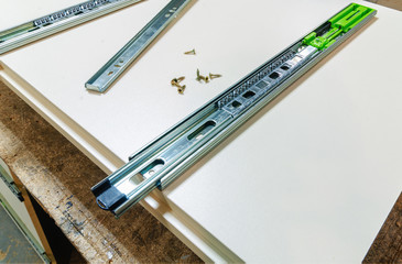 Assembly of hard furniture, close-up drawers for drawers