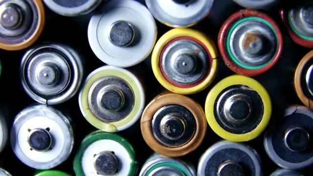 Lot of used batteries from different manufacturers. Electronic waste, collection and recycling, high danger for environment concept