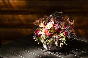 bouquet of summer flowers in a basket