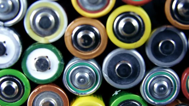 Lot of used batteries from different manufacturers. Electronic waste, collection and recycling, high danger for environment concept
