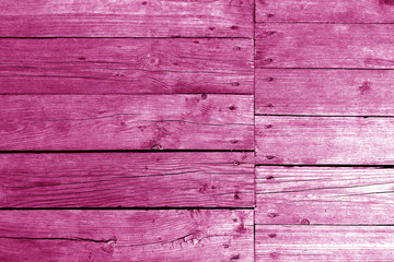 Old wooden wall in pink tone.