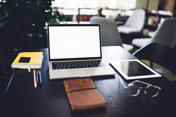 Open laptop placed on wooden table