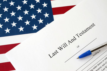 Last Will and testament blank document with pen on United States flag