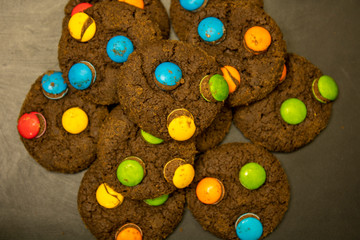 Chocolate Cookies with colorful chocolate candy for background