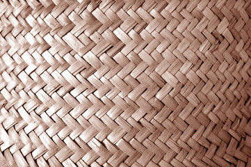 Wicker basket pattern with blur effect in brown tone.