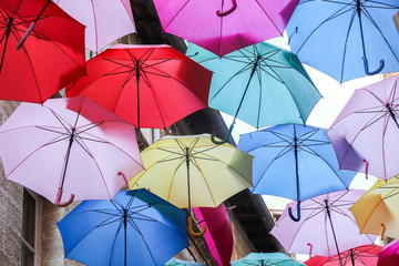 colorful decoration umbrellas on street in old town Avignon