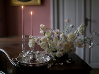  wine glasses with a drink on a vintage tray and a bouquet