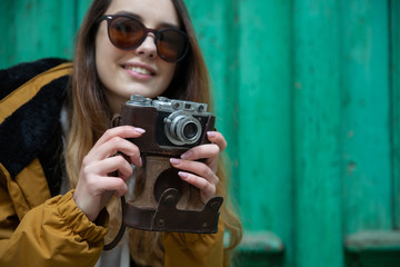 Photo of young tourist girl exploring streets of Baku. Moody photos of teenager girl visiting old city and taking photos of the city