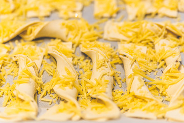 Making cheese stems that just come out of the oven.