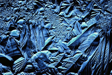 blue ice glass background, abstract texture of the surface of the ice on the glass, frozen seasonal water