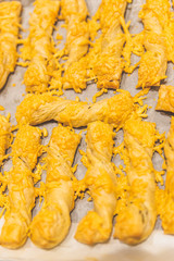 Making cheese stems that just come out of the oven.