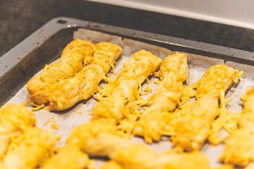 Making cheese stems that just come out of the oven.