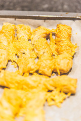 Making cheese stems that just come out of the oven.