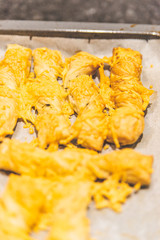 Making cheese stems that just come out of the oven.