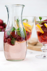  cold strawberry lemonade juice in the glasses with ice cubes