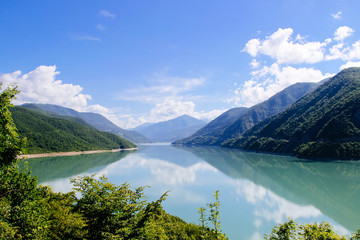 Fototapeta na wymiar Blue lake in the mountains. Mountain reservoir