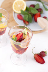  cold strawberry lemonade juice in the glasses with ice cubes