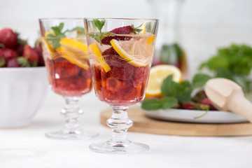  cold strawberry lemonade juice in the glasses with ice cubes