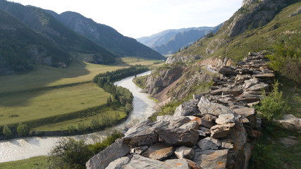 Panoramic view of the bend of the beautiful river in the Altai. Old Chui tract. Summer travel in Russia