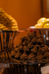 Traditional Arabian cookies with nuts in soft focus. Eastern sweets beautifully served on metal plate. Traditional desert in Egypt.