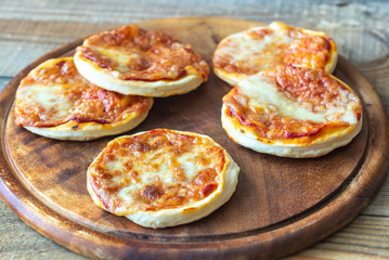 Mini pizzas on the wooden board