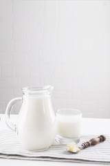 Homemade fermented beverage kefir with kefir grains in bowl on a white background, concept of natural fermented food and intestinal health