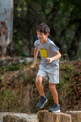 Cute boy outdoor running