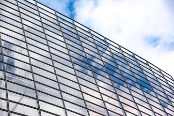 Fototapeta na wymiar The wall of glass windows of a modern building.