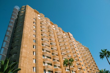 Concrete modernist building sunny day blue sky low angle
