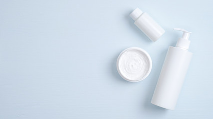 SPA cosmetics products branding mockup. Clear pump bottle for intimate hygiene gel, skin care essential oil, jar with body cream. Flat lay minimalist style. Natural beauty product concept