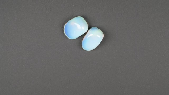 Opalite gemstone isolated on black background. Macro shot.