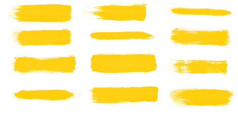 Set of yellow paint smear brushes for painting