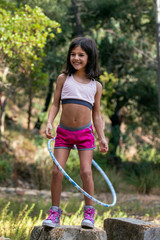 Cute girl posing with hula hoop