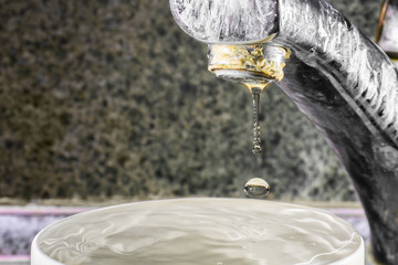 Fototapeta na wymiar Hard water in the kitchen faucet, limescale