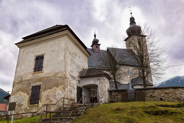 Fototapeta na wymiar Old church of St. John the Baptist outside. Liptovsky Jan village. SLovakia.