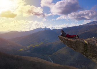 People looking at the landscape at the edge of the cliff of the Zamariain viewpoint, Pyrenees of...