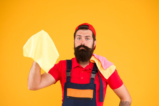 Dirty Work After Remodel or Renovation. Professional window cleaning service. Man brutal bearded worker wiping dust rag. Cleaning supplies concept. Easy cleaning tips. Guy work with piece of cloth