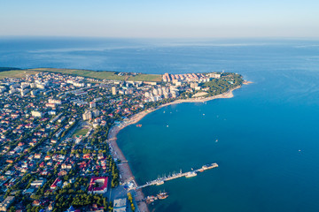 Gelendzhik shooting from a drone. A steep, Thick promontory with a lighthouse and the Central part of the city with a sea pier.