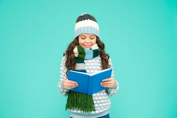 Girl reading book. kid enjoying her book. winter story reading. christmas eve. little book lover. cosy and comfort concept. my favorite story. leisure in winter time. childhood development