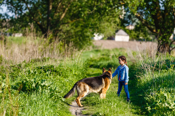 Little girl is scared by a dog.