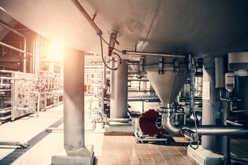 Industrial background. Stainless steel brewing equipment in modern beer factory. Brewery production concept, toned