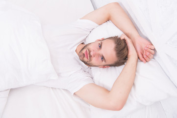 lazy sunday with morning sex. man lying bedroom. time to relax. male health concept. man awake in bed. carefree single male seductive attitude. sexy man in bed. early morning wakeup. reduce stress